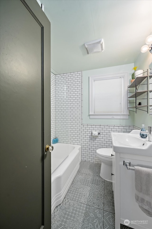 full bathroom with vanity, toilet, independent shower and bath, and tile walls