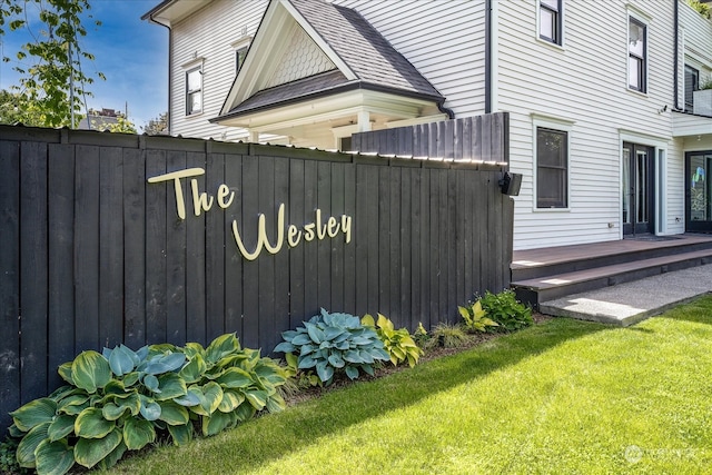 exterior space featuring a lawn and a wooden deck