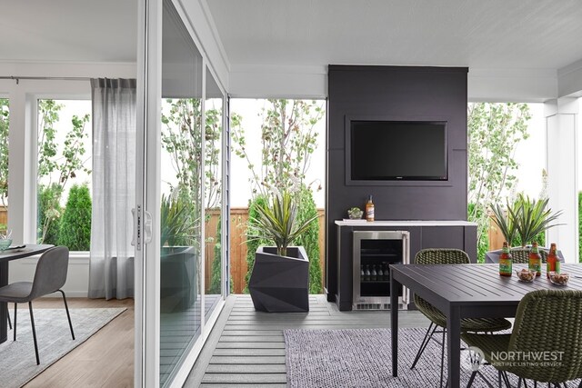 sunroom / solarium featuring wine cooler