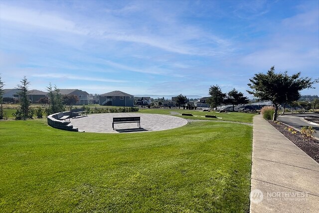 view of home's community with a lawn