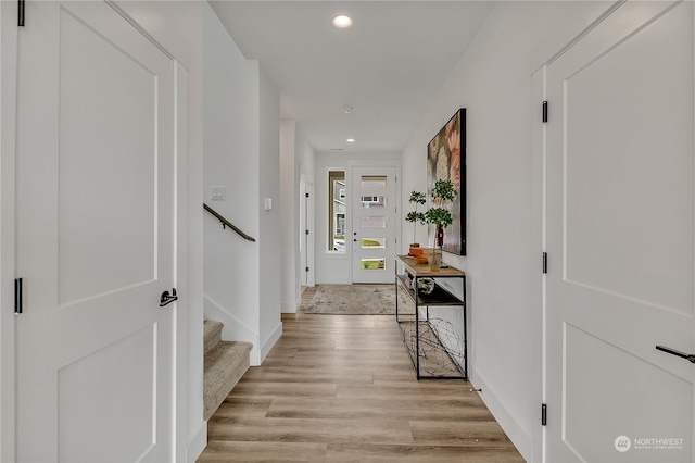 hall with light hardwood / wood-style floors