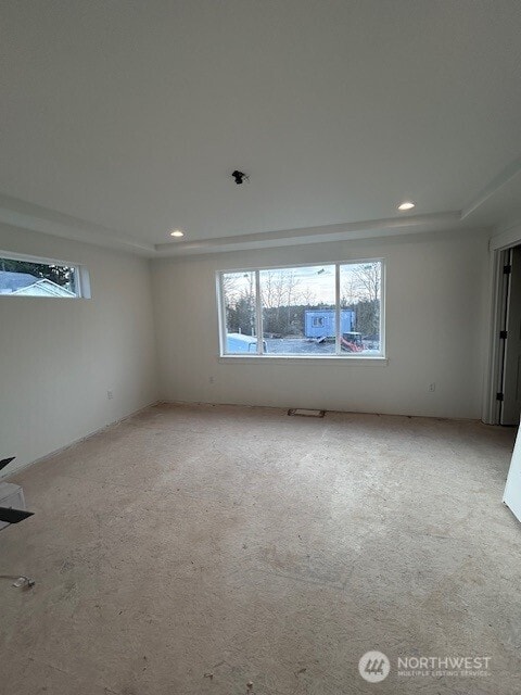 empty room with recessed lighting and carpet floors