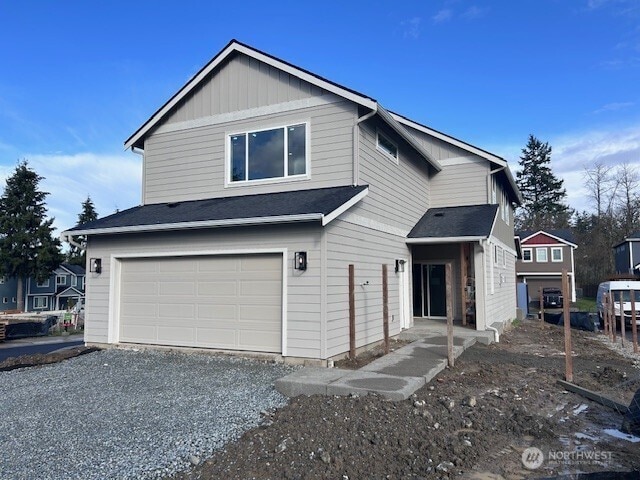 view of front of home with an attached garage and driveway