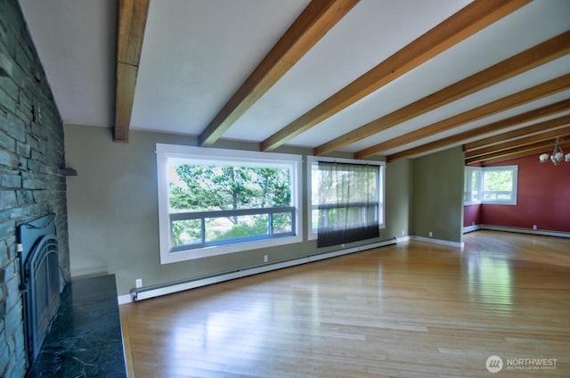 unfurnished living room featuring a baseboard heating unit, a chandelier, beam ceiling, and wood finished floors