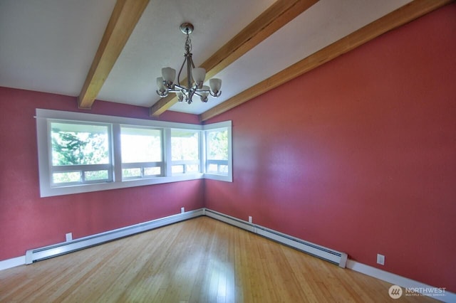 empty room featuring a baseboard heating unit, beam ceiling, a healthy amount of sunlight, and an inviting chandelier