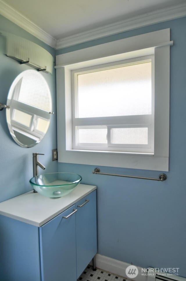 bathroom featuring vanity and crown molding