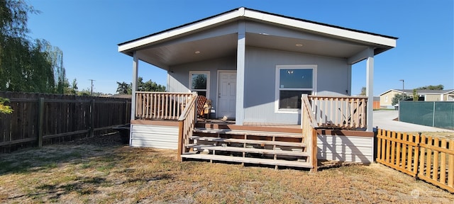 rear view of property with a deck