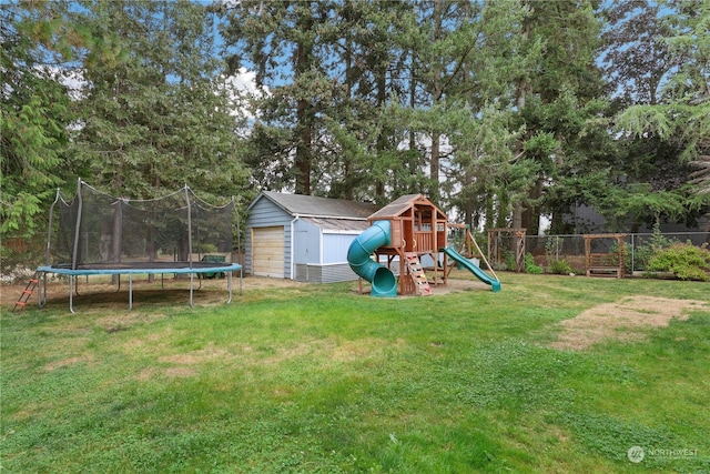 view of yard with an outbuilding, fence, a storage shed, a playground, and a trampoline