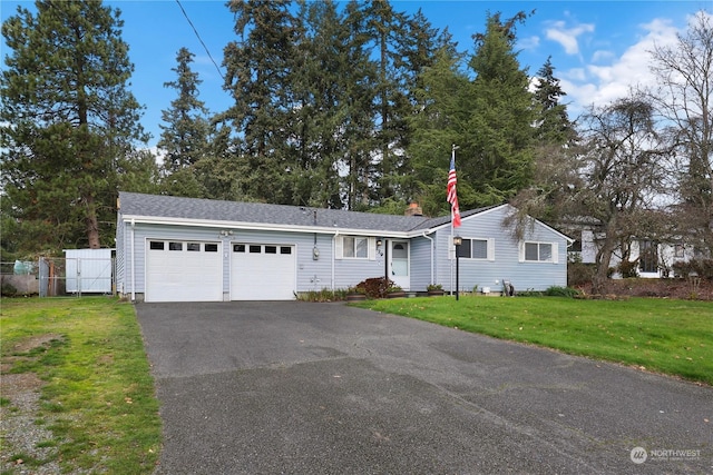 single story home featuring a front lawn, aphalt driveway, fence, an attached garage, and a chimney