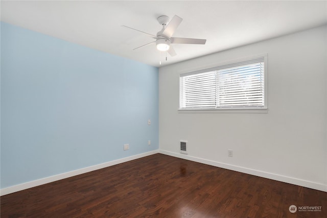 unfurnished room with visible vents, a ceiling fan, baseboards, and dark wood-style flooring