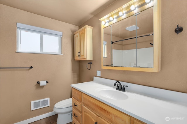 bathroom featuring visible vents, toilet, walk in shower, and vanity