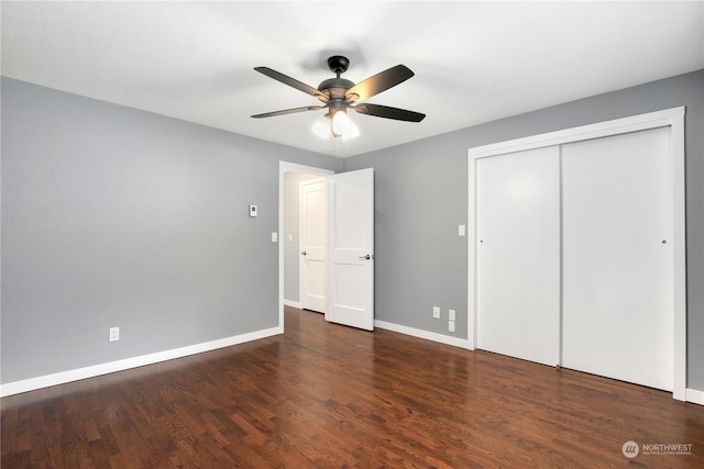 unfurnished bedroom with a closet, ceiling fan, baseboards, and wood finished floors