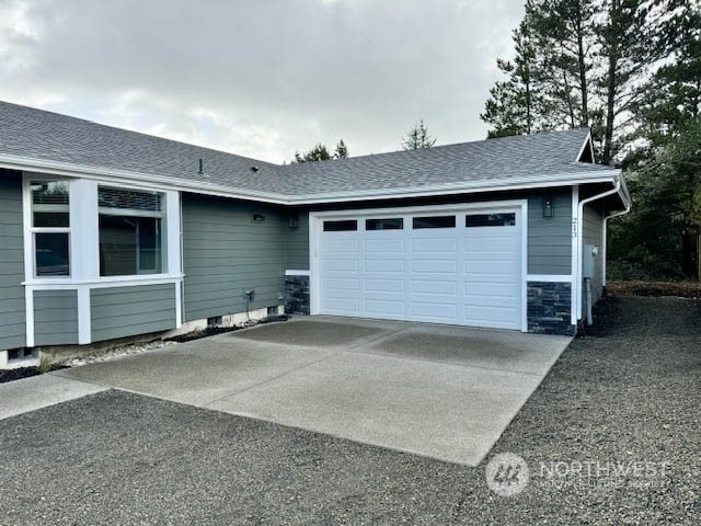 garage with concrete driveway