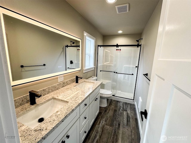 full bath with a sink, visible vents, toilet, and a stall shower