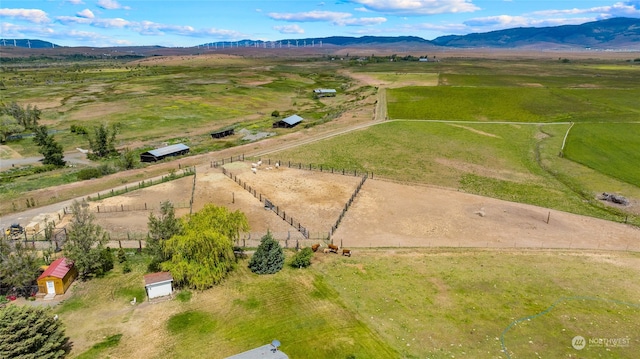 birds eye view of property featuring a rural view and a mountain view