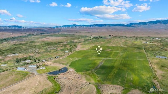 aerial view featuring a rural view and a mountain view