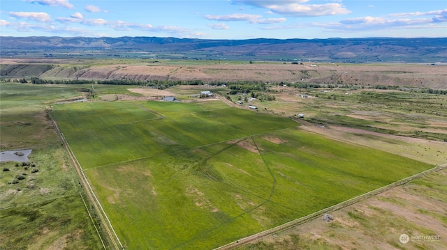 drone / aerial view with a mountain view and a rural view