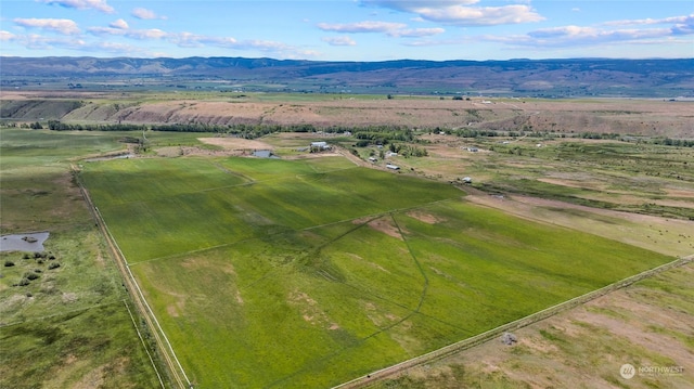 aerial view featuring a rural view and a mountain view