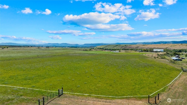 drone / aerial view featuring a mountain view and a rural view