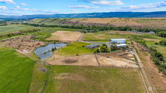 bird's eye view featuring a water and mountain view and a rural view