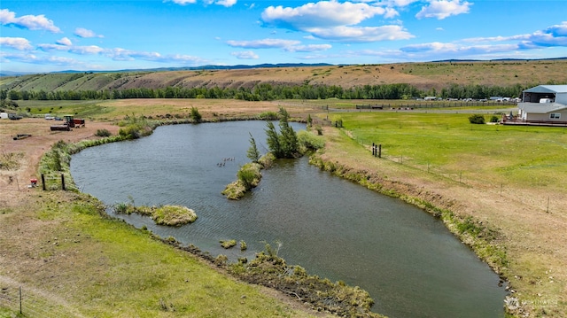 bird's eye view with a water view and a rural view