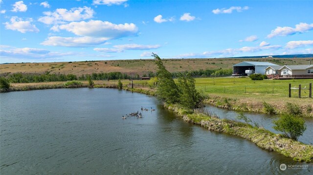 property view of water with a rural view