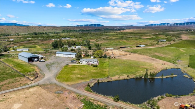 birds eye view of property with a rural view and a water and mountain view