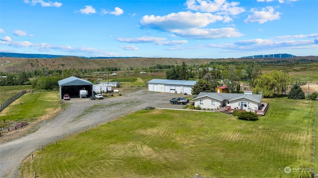 bird's eye view featuring a rural view and a mountain view