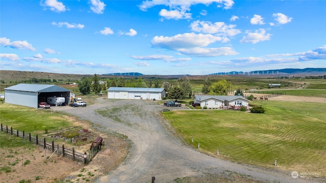 drone / aerial view with a mountain view and a rural view