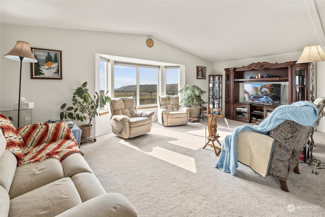 carpeted living room with lofted ceiling