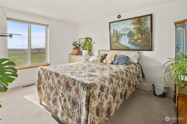 bedroom with carpet flooring and visible vents