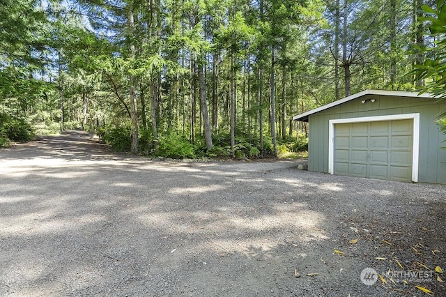 detached garage featuring driveway