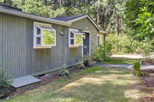 view of home's exterior featuring a yard