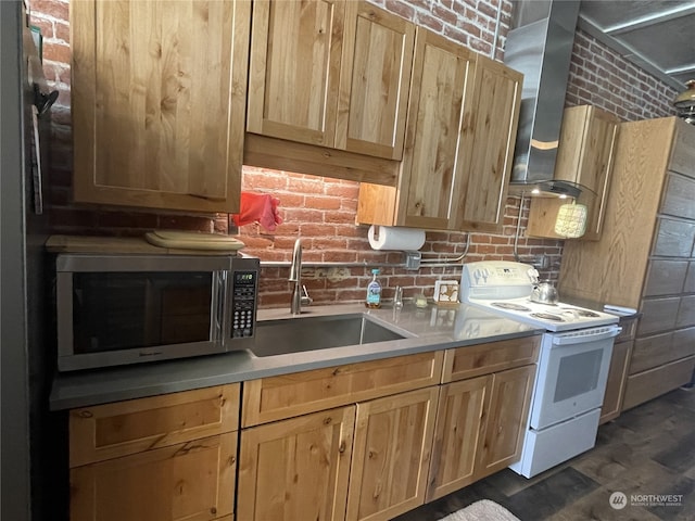 kitchen featuring brick wall, white range with electric stovetop, sink, and light brown cabinetry