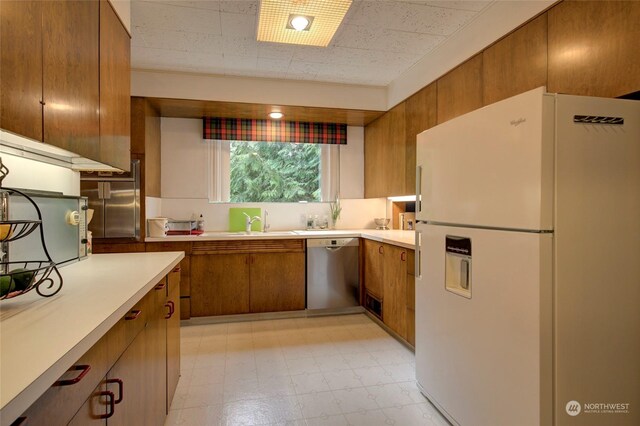 kitchen with sink and appliances with stainless steel finishes