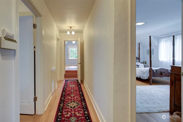 corridor featuring light wood-type flooring