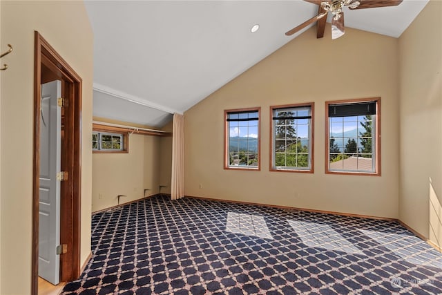 interior space with carpet, ceiling fan, and vaulted ceiling with beams