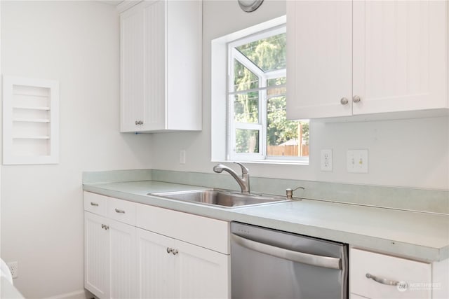 467 28th Ave, Longview, WA 98632 - kitchen featuring stainless steel dishwasher, a sink, light countertops, and white cabinetry