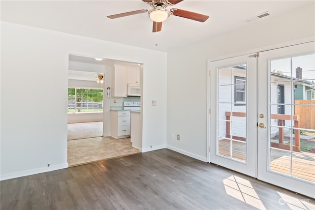 interior space featuring french doors, dark hardwood / wood-style flooring, and ceiling fan