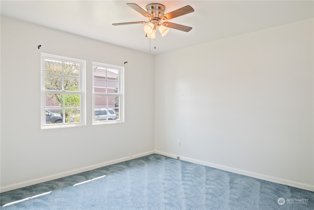 carpeted empty room with ceiling fan