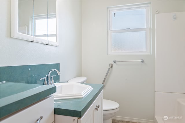 bathroom featuring vanity and toilet