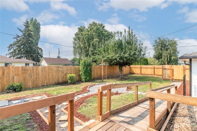 wooden deck with a lawn