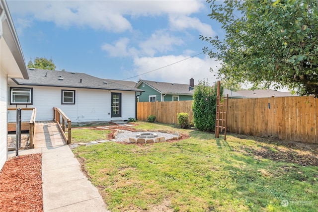 view of yard with an outdoor fire pit