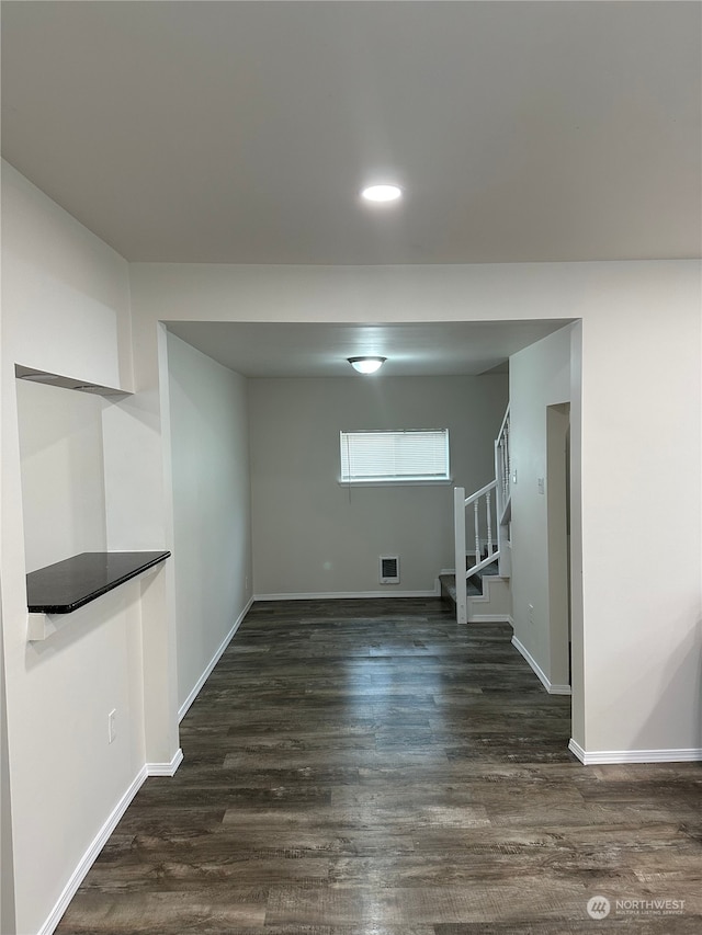 basement featuring dark hardwood / wood-style flooring