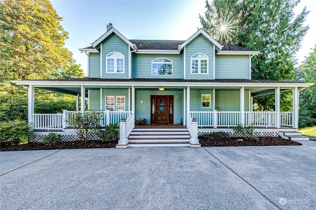 farmhouse inspired home featuring a porch