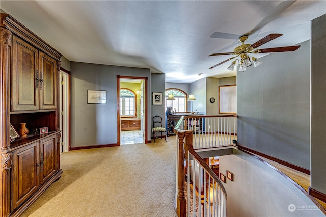 interior space featuring light colored carpet and ensuite bathroom