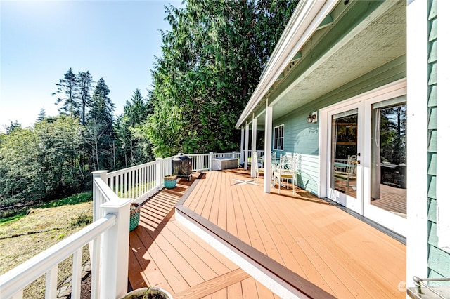 wooden terrace featuring french doors