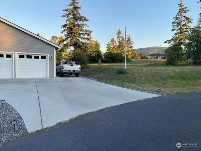 garage featuring a yard