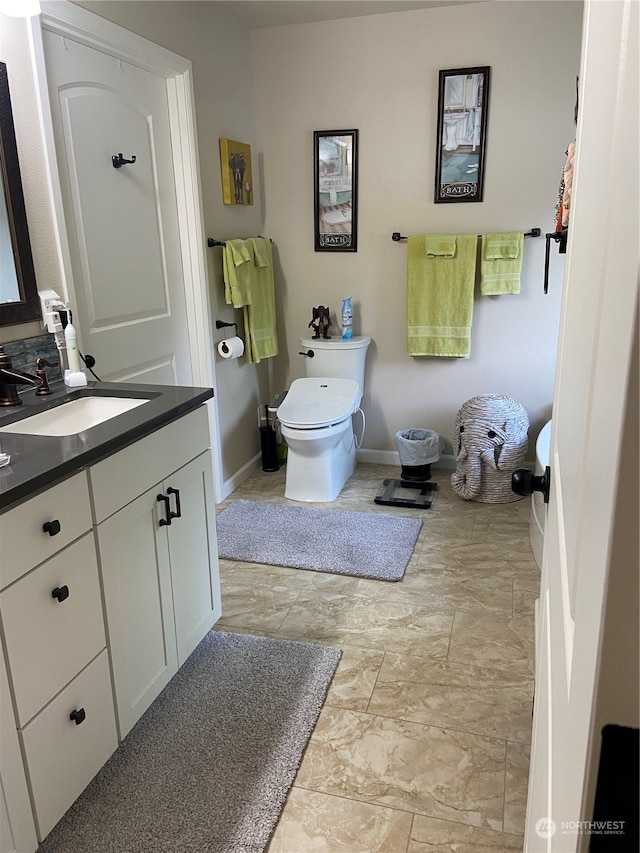 bathroom with vanity and toilet