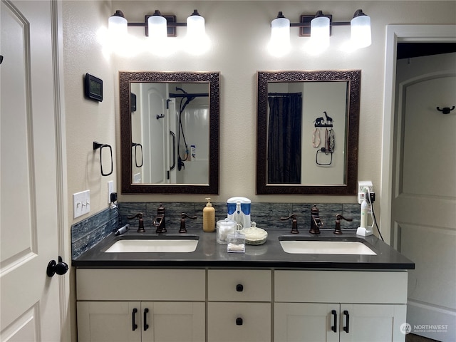 bathroom featuring a shower with curtain and vanity